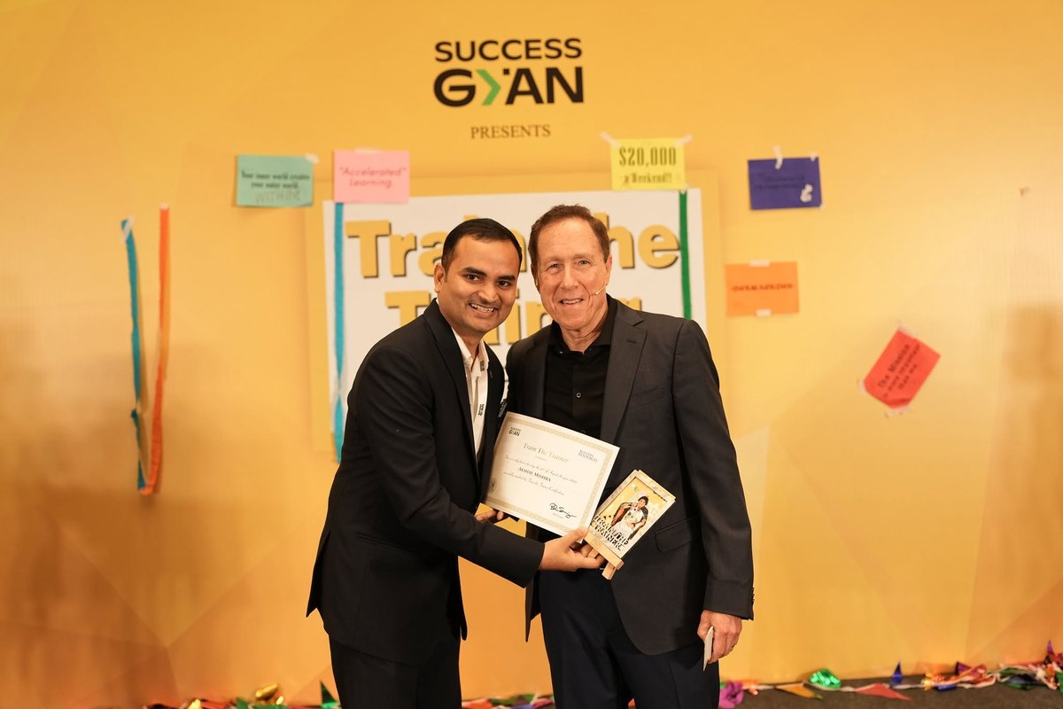 Akshay Mishra receiving his Train The Trainer certificate on stage at Success Gyan